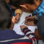 Continuous Learning - Children are writing on a white board